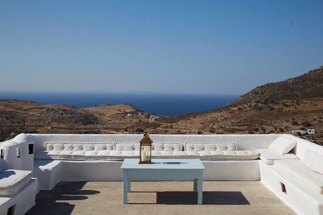 This vacation home rental in Greece is huddled among the historic whitewashed houses of Hora overlooking the Aegean, under the watchful gaze of the magnificent 11th-century monastery above.